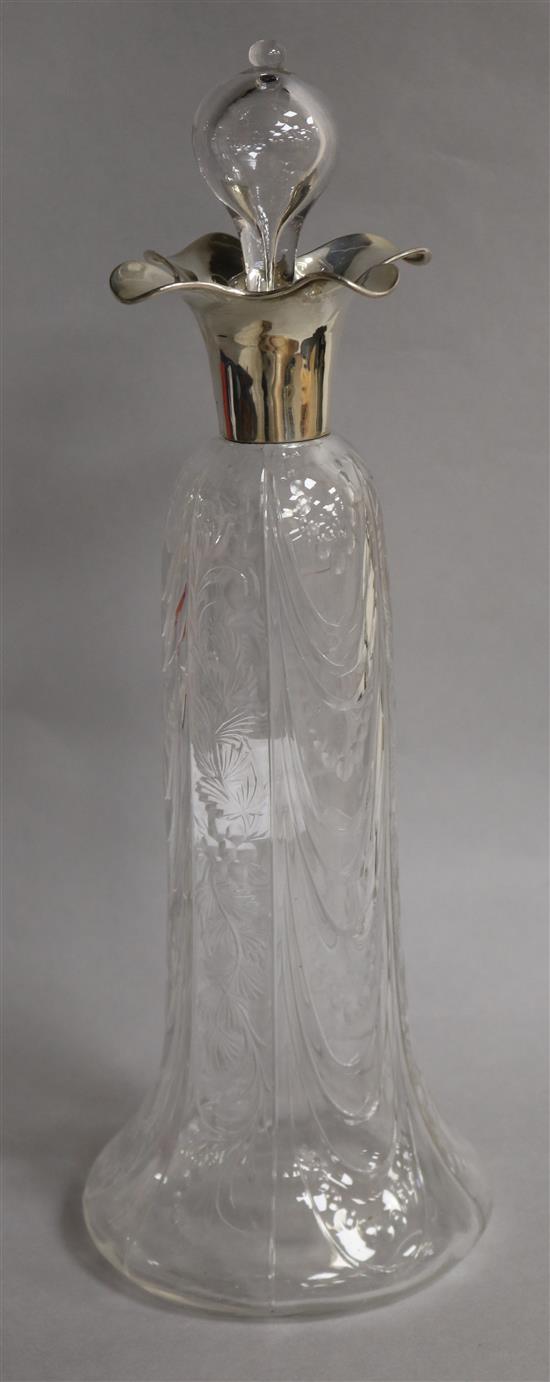 An Edwardian silver mounted rock crystal glass decanter, William Comyns, London, 1904, in the manner of Stevens & Williams, 35cm.